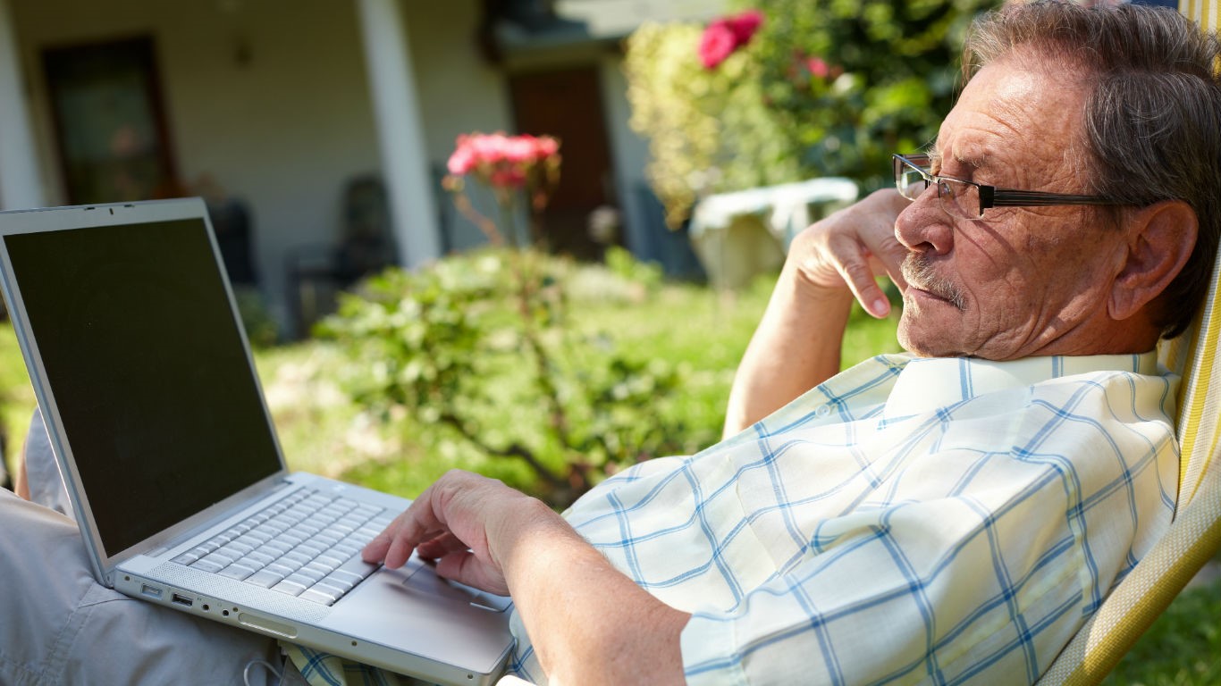 Man working on a laptop outside (Image: Shutterstock)