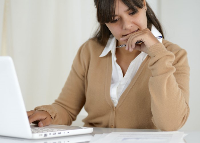 Woman working on laptop. (Image: Shutterstock)